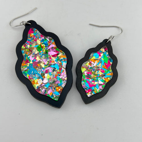 Confetti Kiss Scallop Earrings shown in black wood
