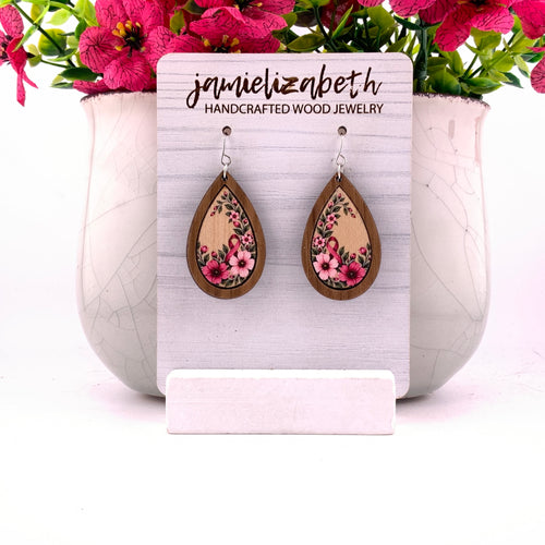 Pink awareness ribbon surrounded by flowers and greenery, teardrop earrings with Walnut wood frames by Jamielizabeth