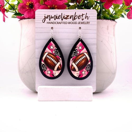 Football artwork with pink accents and stars, teardrop earrings with Black wood frames by Jamielizabeth