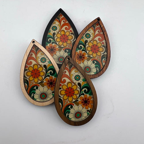 Flower Power retro floral teardrop earring design in maple, walnut, black and Texas mesquite wood frames.