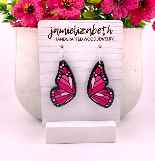 Love Is Like a Butterfly Earrings – Dolly Pink, large, shown in black wood