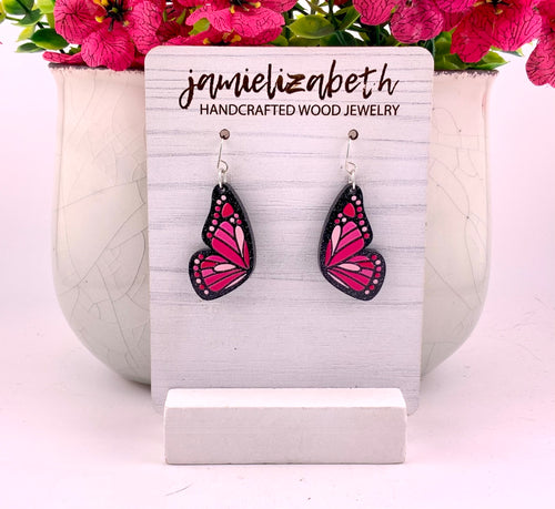 Love Is Like a Butterfly Earrings – Dolly Pink, medium, shown in black wood