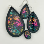 Neon After Dark Earrings shown in black wood